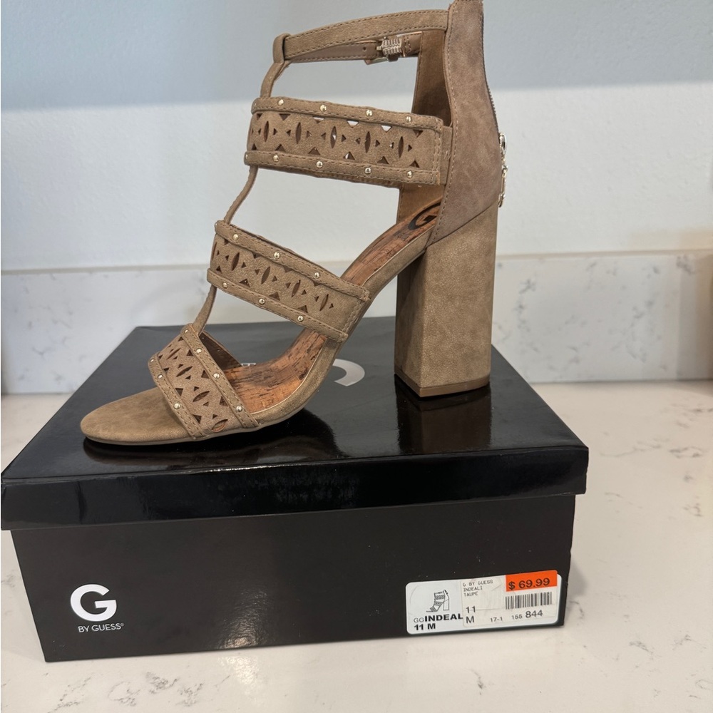 Guess sandals. Taupe. Only worn around the house. Too tall for me.